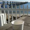 cup on a table near river